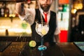 Bartender pouring alcoholic drink in glass Royalty Free Stock Photo