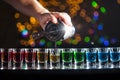 Bartender pouring alcoholic drink into small glasses on bar. Colorful cocktails at the bar. Royalty Free Stock Photo