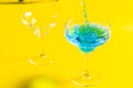 Bartender pouring Blue Lagoon  curacao syrup mixed with vodka and lemonade cocktail Royalty Free Stock Photo