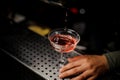 Bartender pouring campari liquor into the cocktail Royalty Free Stock Photo