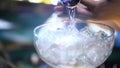 Bartender pouring cocktail into a glass with ice, macro shot Royalty Free Stock Photo