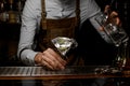 Bartender pouring a martini cocktail from jar Royalty Free Stock Photo