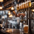 A bartender pouring a draft beer into a tall, frosty glass with a perfect head2 Royalty Free Stock Photo