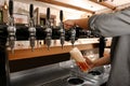 Bartender pouring fresh beer into glass in pub, closeup Royalty Free Stock Photo