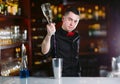 Bartender pouring fresh cocktail in fancy glass Royalty Free Stock Photo