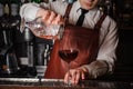 Bartender pouring fresh cocktail in fancy glass Royalty Free Stock Photo