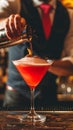 Bartender Pouring a Garnished Cocktail at an Ambient Bar During Evening Hours