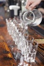 Bartender pouring glasses