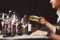 Bartender pouring sparkling white wine into wineglasses. Royalty Free Stock Photo