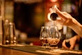 Bartender pouring whisky in a glass Royalty Free Stock Photo