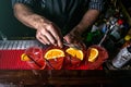 The bartender prepares cocktails