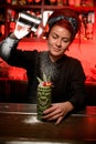 Bartender preparing alcohol cocktail with salt shaker Royalty Free Stock Photo