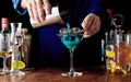 Bartender preparing a blue Curacao cocktail Royalty Free Stock Photo