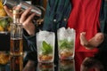 Bartender preparing delicious mint julep cocktail