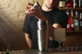 Bartender preparing fresh alcoholic cocktail at bar counter Royalty Free Stock Photo