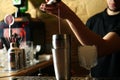 Bartender preparing fresh alcoholic cocktail at bar counter Royalty Free Stock Photo