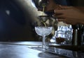 Bartender preparing fresh alcoholic cocktail at bar counter Royalty Free Stock Photo