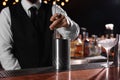 Bartender preparing fresh alcoholic cocktail at bar counter, closeup Royalty Free Stock Photo