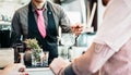 Bartender preparing gin tonic cocktail - People having fun in american bar waiting for barman serving drinks