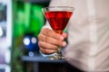 Bartender serving a red martini Royalty Free Stock Photo
