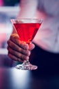 Bartender serving a red martini Royalty Free Stock Photo