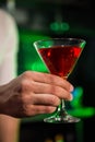 Bartender serving a red martini Royalty Free Stock Photo