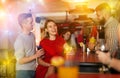 Bartender shaking cocktail for friends in nightclub Royalty Free Stock Photo