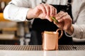 Bartender squeezing fresh lime juice into the cup Royalty Free Stock Photo