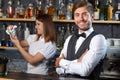 Bartender and a waitress during work Royalty Free Stock Photo