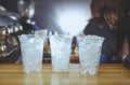 Bartender wearing medical latex black gloves, making mojito cocktail.Pieces of ice,ingredient for cooling drinks in bar