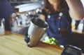 Bartender wearing medical latex black gloves,making mojito cocktail.Process of bartending in bar Royalty Free Stock Photo