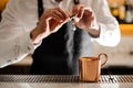 Bartender in white shirt squeezing fresh lime juice into the cup Royalty Free Stock Photo