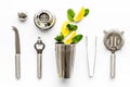 Bartender work desk with equipment and cocktail ingredietns Shaker, lime, ice on white background top-down pattern Royalty Free Stock Photo