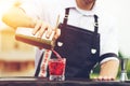 Bartender workplace. Selective focus on a bartender who adding l