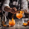 A bartenders hands expertly flaming the surface of a cocktail with an orange peel twist2 Royalty Free Stock Photo