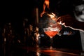 Bartenders hands making a fresh cocktail with a smoky note Royalty Free Stock Photo