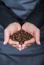 Barttender holds coffee beans