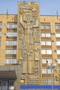 Bas-relief on the building. The figure of a woman in full growth. Abakan. Russia