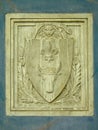 Bas relief of coat of arms with bull and sword, detail of the chapel of the abbey of Chaalis