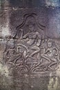 Bas-relief depicting ancient stories on the walls of Bayon temple Angkor Wat Cambodia.