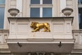 A bas-relief of a golden lion on the balcony. Royalty Free Stock Photo