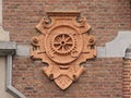 Bas relief of metalworking tools, detail of historical building in eclectic style in Ghent