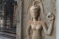 Bas-relief mural of the woman Apsara on wall Angkor Wat temple complex, close up