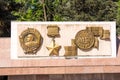 Bas-relief of the Order of Lenin, medal for the defense of Stalingrad on the Alley of Heroes in Volgograd Royalty Free Stock Photo