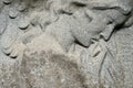 Bas relief sculpture of a grieving woman on a grave