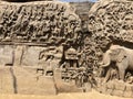 Bas relief rock cut sculptures of Gods, people and animals carved in monolithic rock Royalty Free Stock Photo