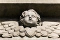 Bas-relief of a small angel on facade of church Royalty Free Stock Photo