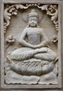 Bas-relief stone sculpture of Buddha Royalty Free Stock Photo