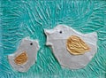 The bas-relief - `two birds`, handmade - made by putty and painted with acrylic paints.