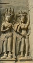 Bas-relief of two dancing apsaras in Angkor Wat temple Royalty Free Stock Photo